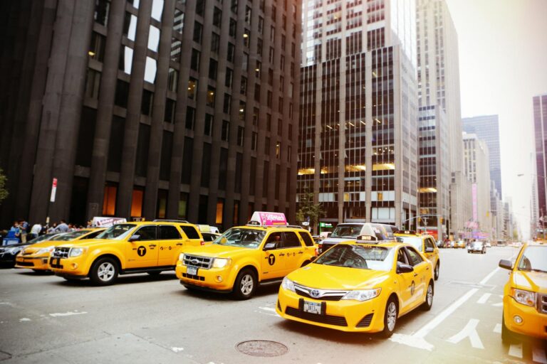 yellow vehicles at the street